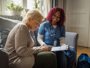 Qalcare staff with senior patient